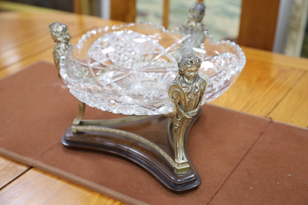 A 19th century silver plated figural centrepiece with deeply cut glass bowl, 34cm diameter